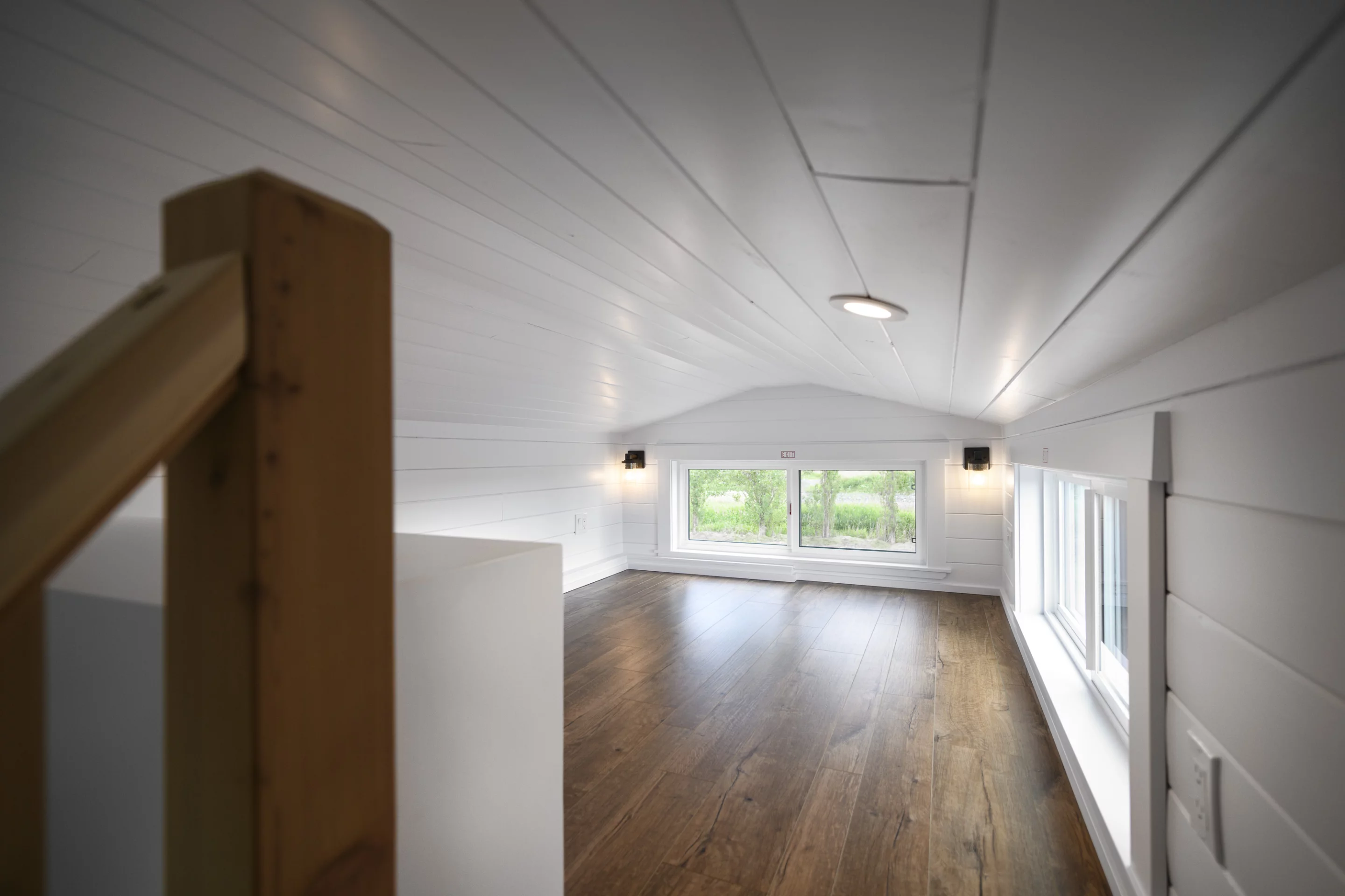 The Traveler's Paradise's loft-style bedrooms are typical tiny house bedrooms with low ceilings