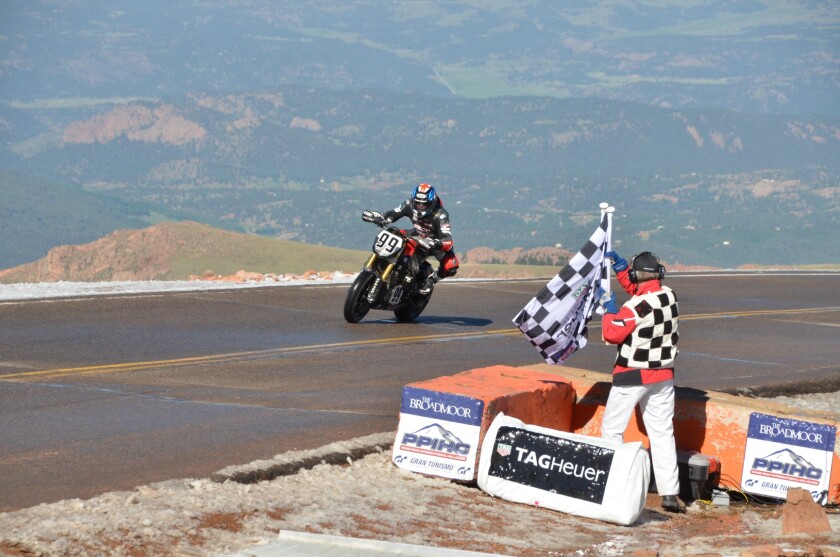 Don Canet crosses the finish line on the Victory Empulse RR