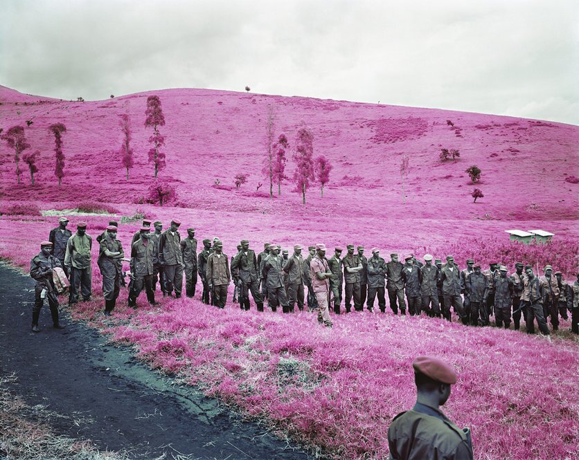 Richard Mosse's amazing series "Infra" depicts rebels in an African civil war using a discontinued military grade infrared film stock that adds surreal pink hues to a landscape devastated by violent conflict