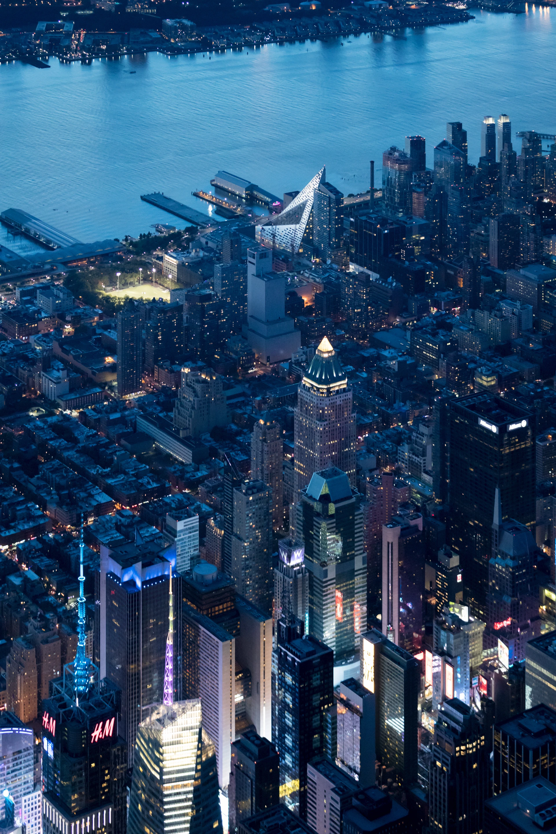 The tetrahedral building rises to a height of 450 ft (137 m) over the Hudson River