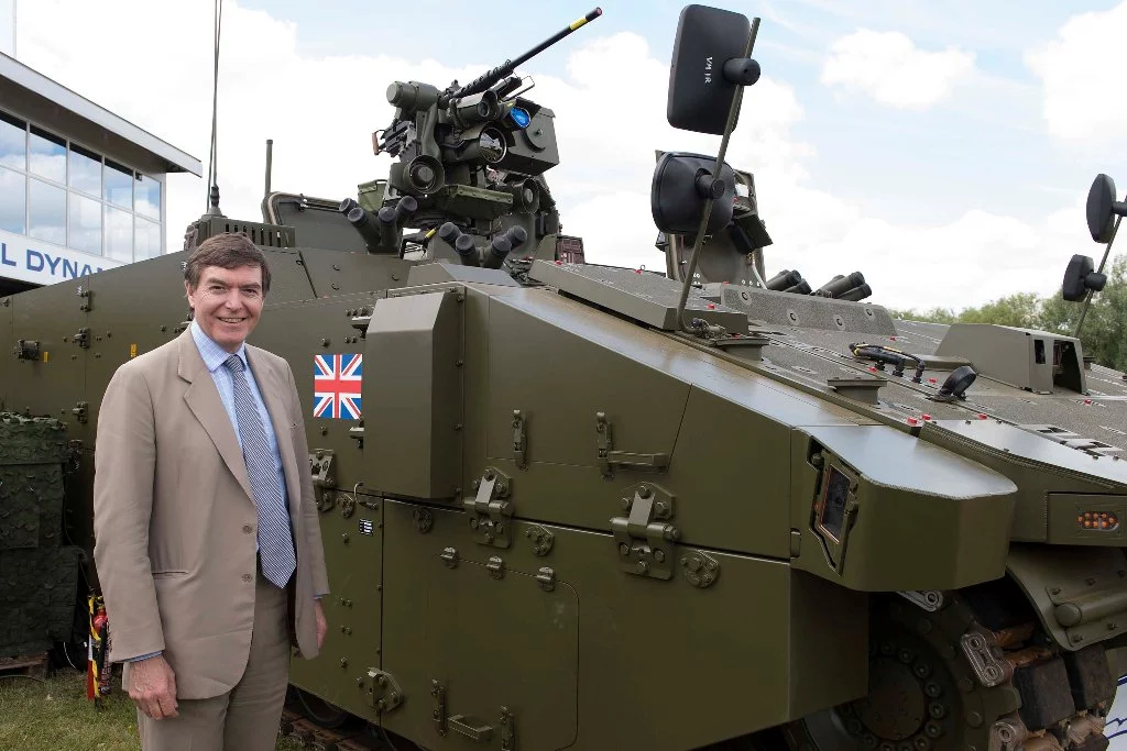 Philip Dunne MP, Minister for Defence Equipment, Support and Technology with SCOUT SV pre-production prototype at DVD 2014 (Image: Crown Copyright)