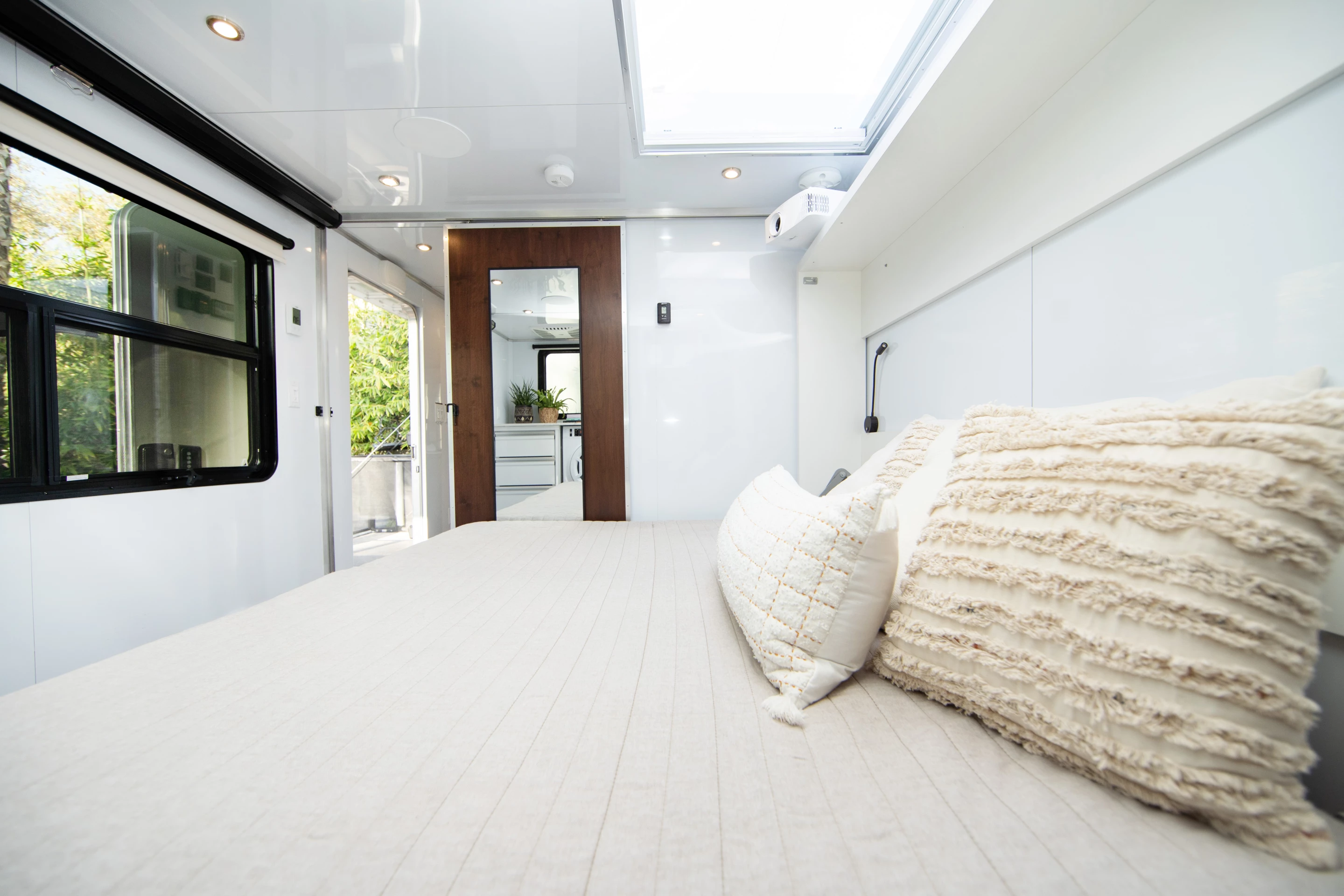 The Living Vehicle bedroom looks like a simple enough RV bedroom