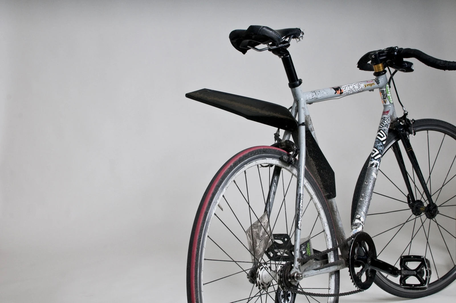 The QuickFix mudguard attaches to a bike in seconds, and packs flat when not in use