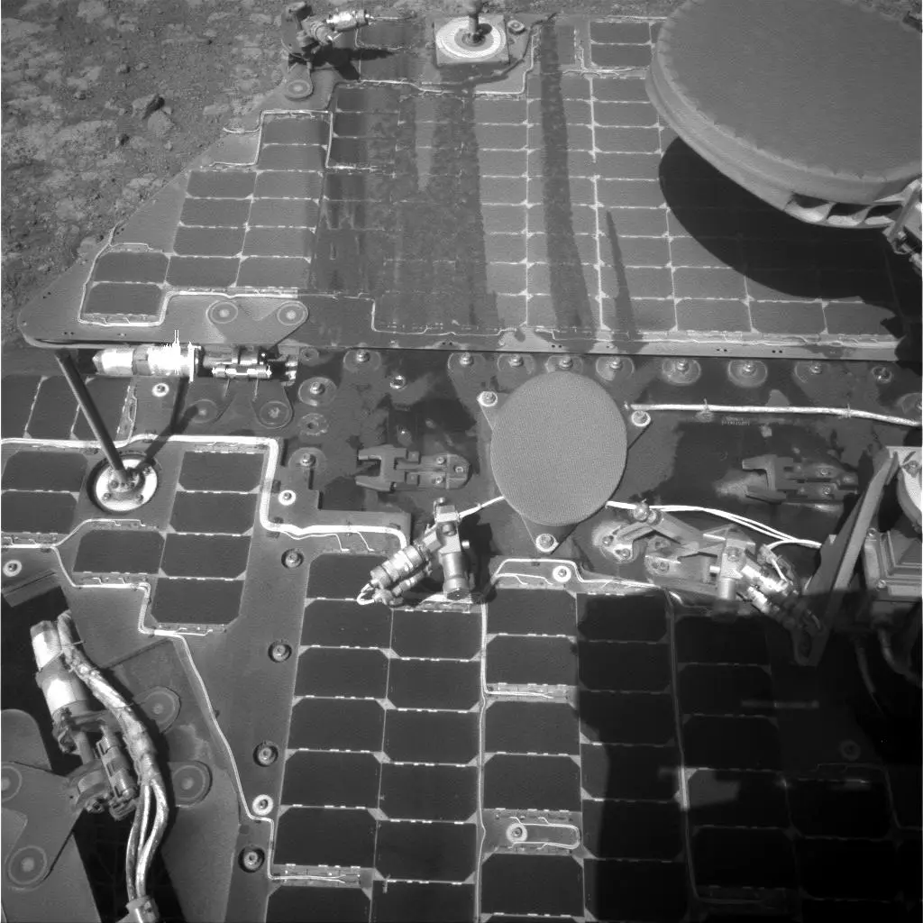 Opportunity taking a self-portrait showing dust sliding off its solar panels while climbing a steep grade