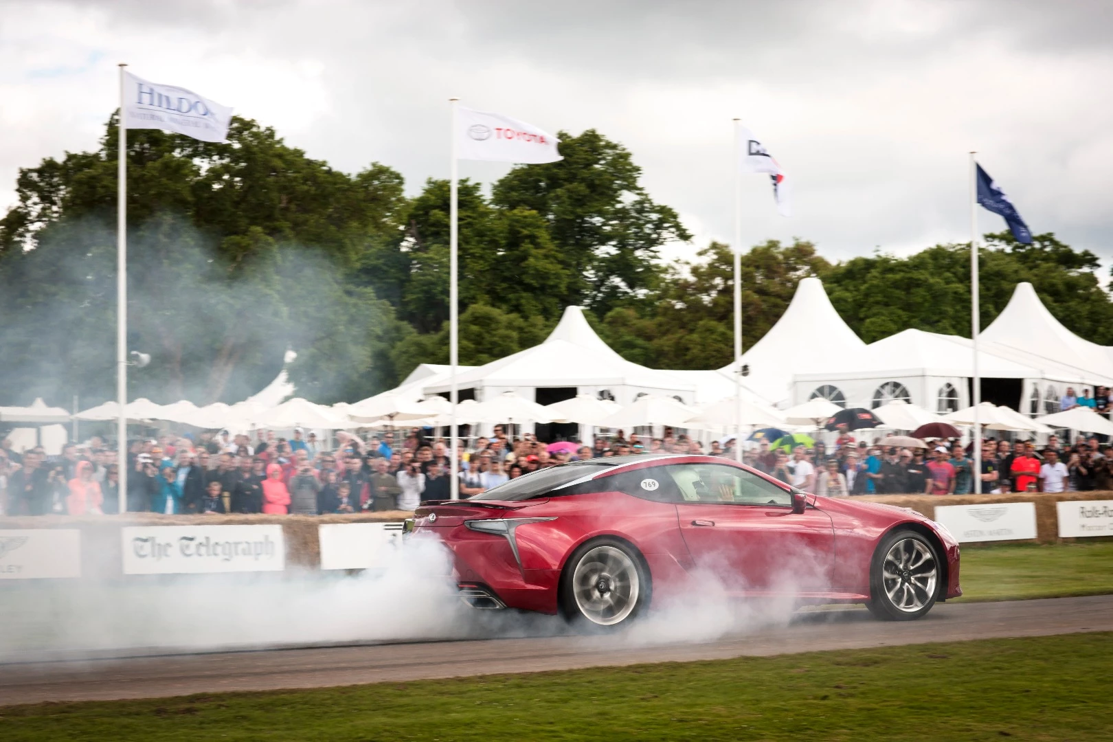 The Lexus LC500 proves it's not your average, beige Lexus by ripping a massive burnout in front of the crowd