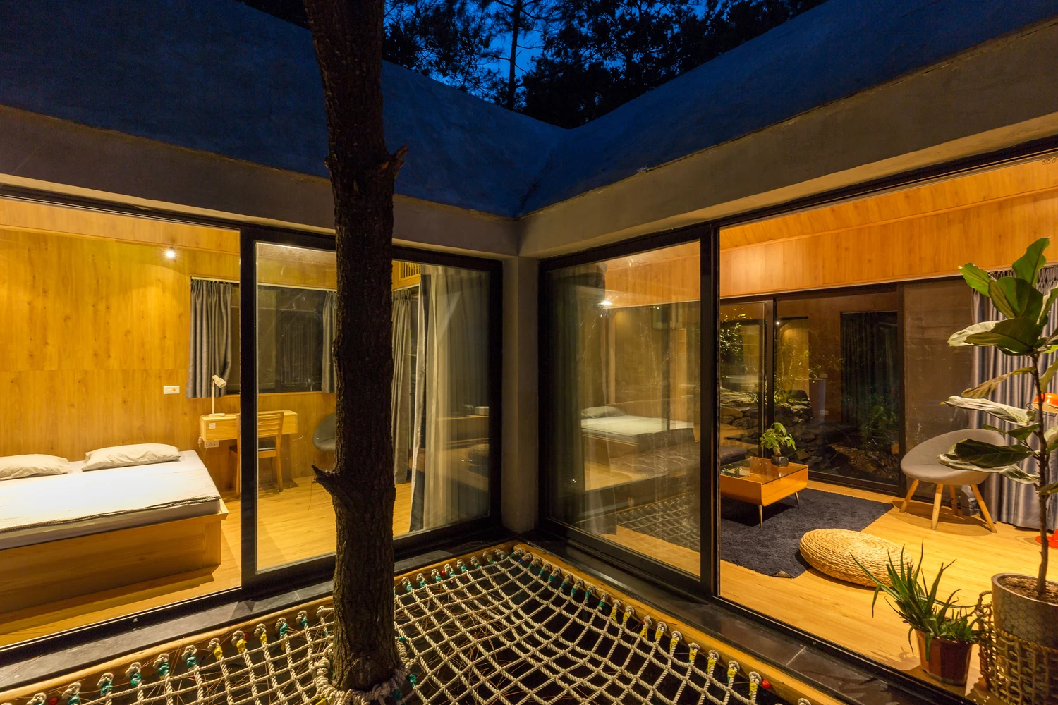The home features warm interior timber cladding on the walls and ceiling and polished wooden floors throughout