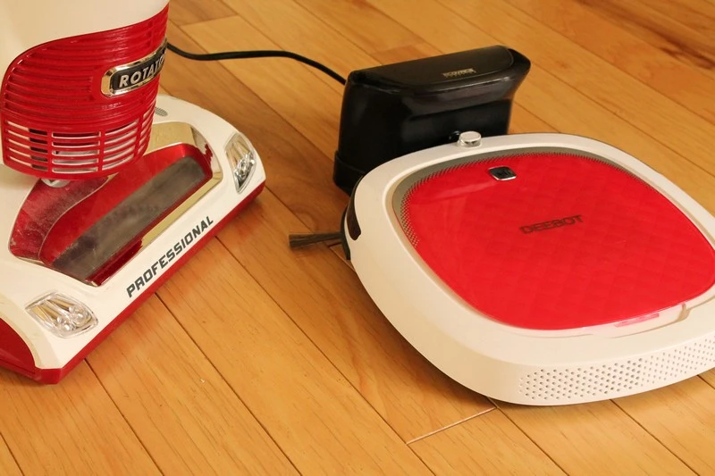 Deebot D35 and a traditional manual vacuum cleaner