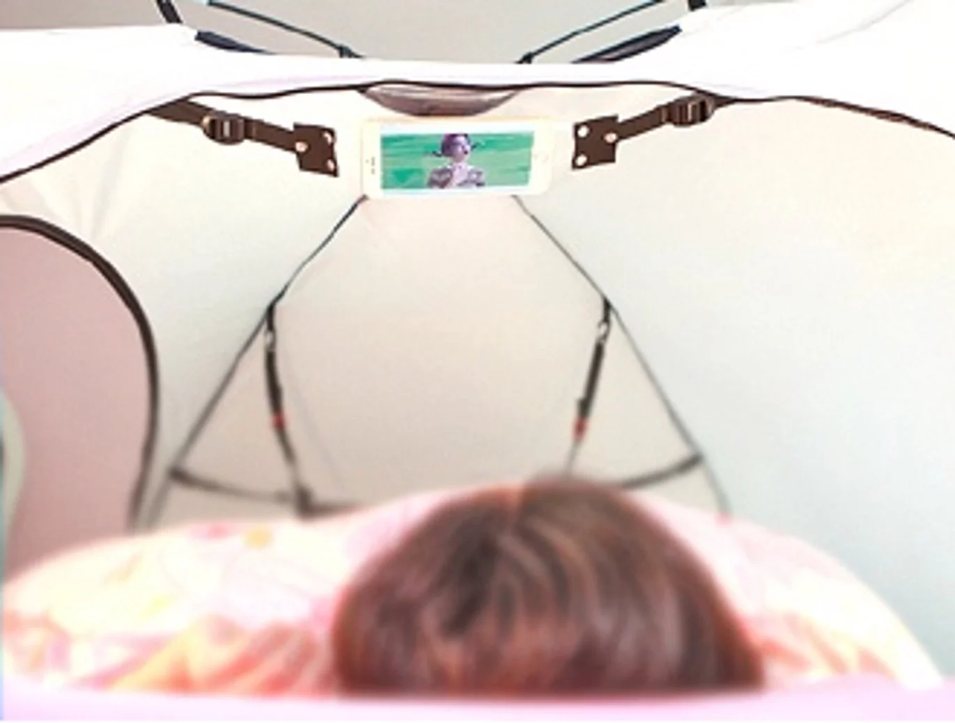 The Room in Room phone stand allows for comfortable video watching in bed
