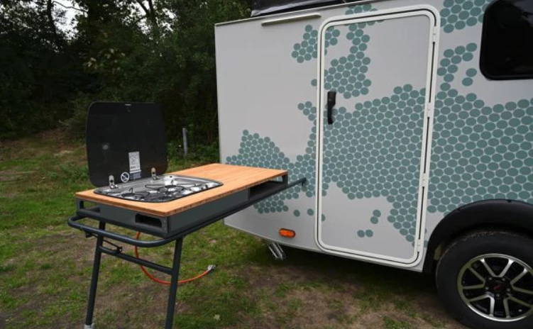 The entire stovetop unit transfers from inside to outside