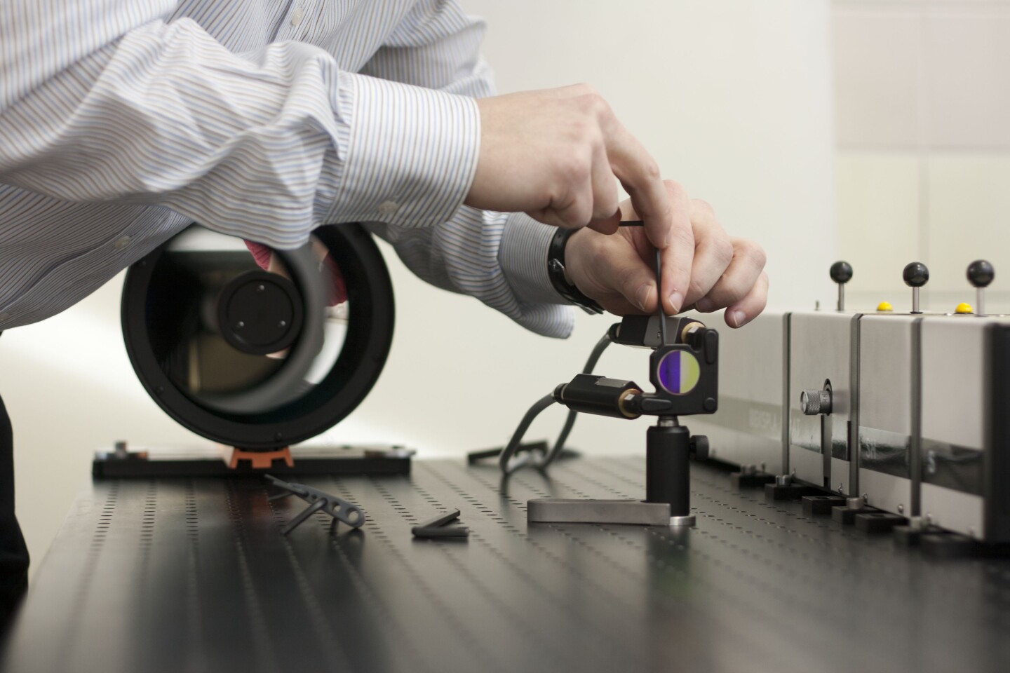 Using lasers to look through container walls from a distance and detect explosives