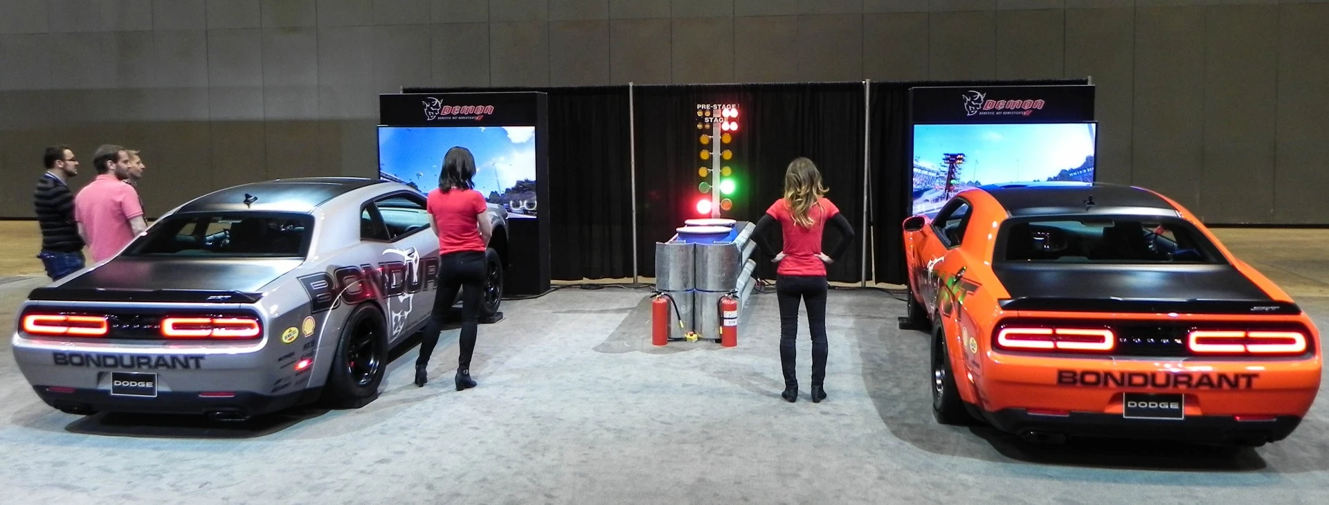 How much fun are auto shows? How about this virtual drag racing setup featuring two Dodge Demons on reactive chassis frames for a totally realistic experience?