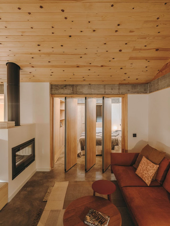Separated by floor-to-ceiling timber slats, the master bedroom can open-up completely with the lounge area