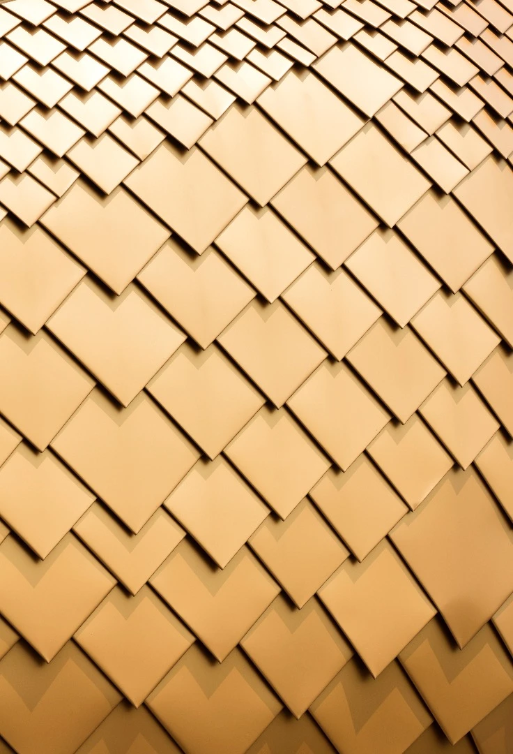 The golden structure is clad in steel plate