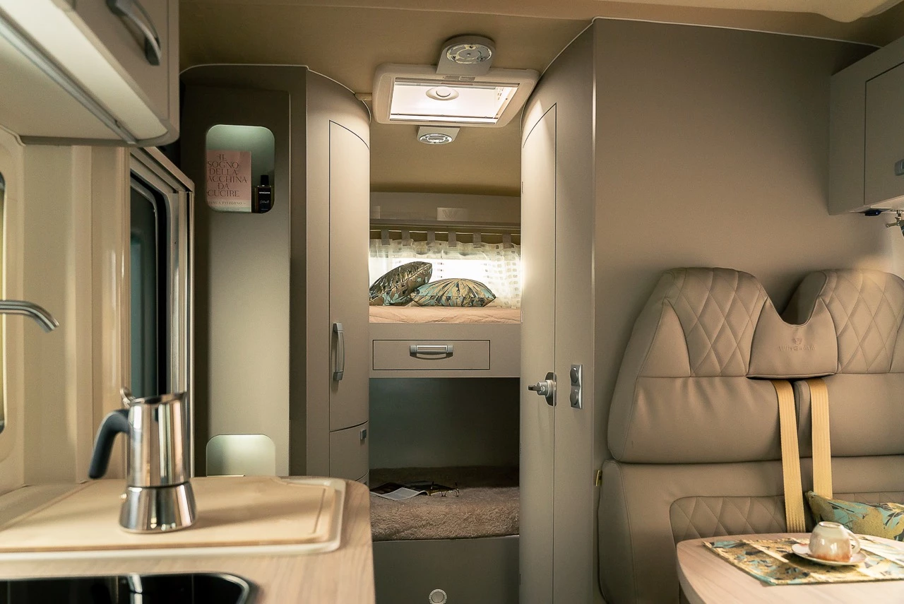 The Oasi 610 GL sleeps four people on its combination of lift-away double bed and rear bunk beds