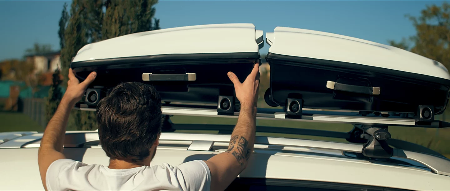 Horizontally placed on the Lugga roof rack bottom-to-bottom, two of the suitcases present a streamlined profile not unlike that of a car-top roof box