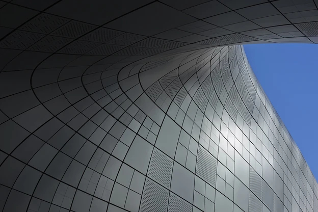 The DDP's external facade panels are composed of fair-faced concrete, aluminum, steel, and stone (Photo: Virgile Simon Bertrand)