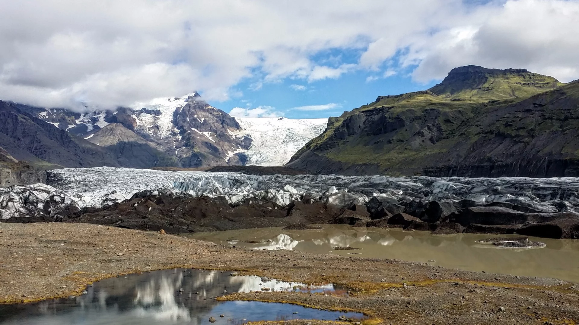 At another outlet of Vatnajökull glacier, visitors are invited to don crampons and walk out on the icy surface. The glacier measures nearly 1,000 m (3,280 ft) thick at its deepest point, with an average thickness of 500 m (1640 ft). It's total ice volume is estimated at 3,300 cubic km (791 cubic mi). That's changing fast as the warming climate accelerates the glacier's retreat. Many of Icleand's glaciers are melting at a rate of about one meter per year, with an even more accelerated rate seen in outlets like this one.