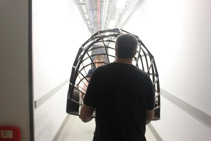 The frame for the Stained Glass Driverless Sleeper Car is carried to the glass workshop (Image: Sylvain Deleu)