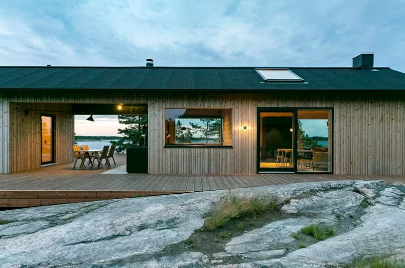 Both structures are built with a hidden timber frame and are clad with vertical timber panels