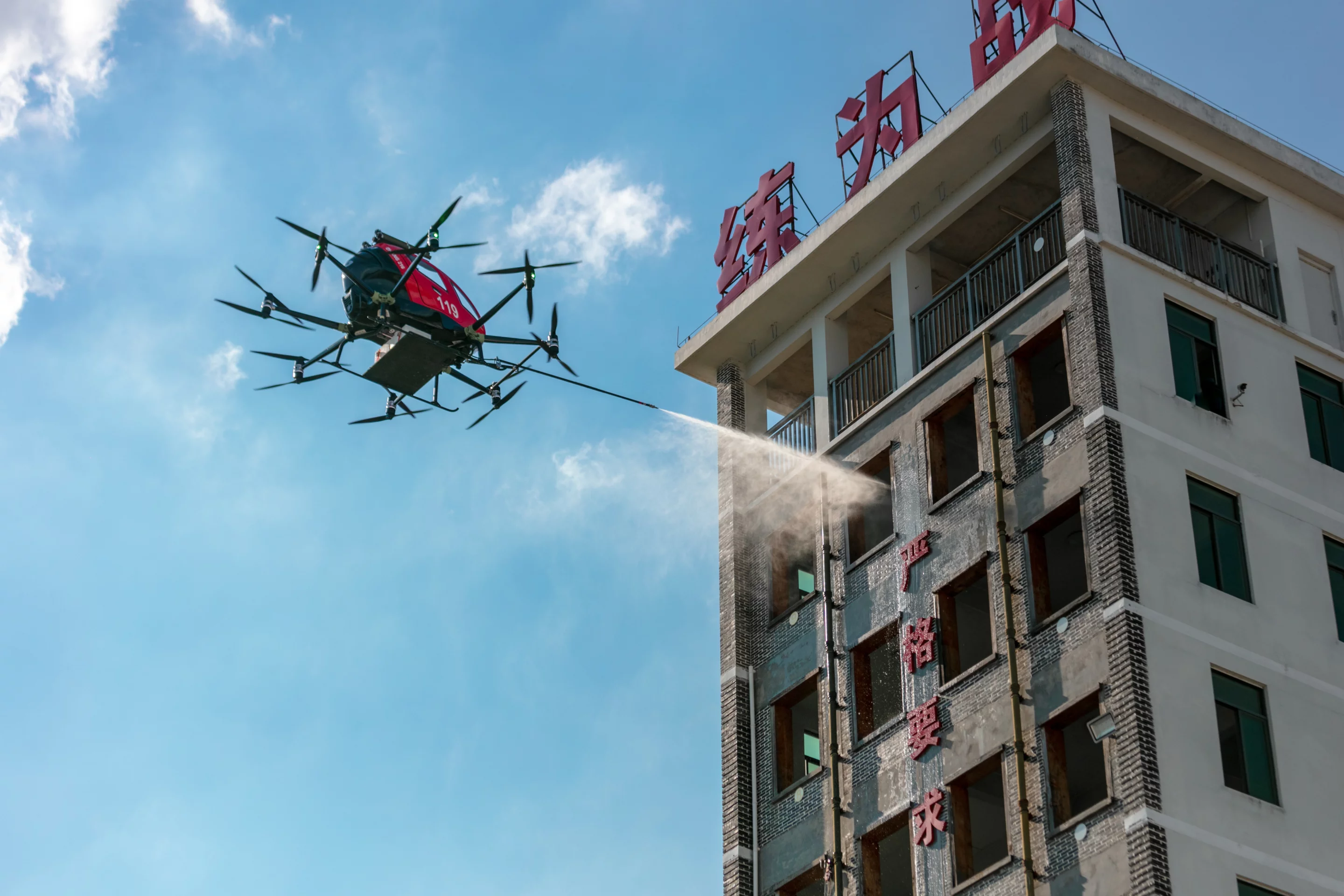 The EHang 216F uses zoom cameras to locate the blaze, and then employs a laser-guided window breaker before launching extinguisher bombs and spraying the fire with foam