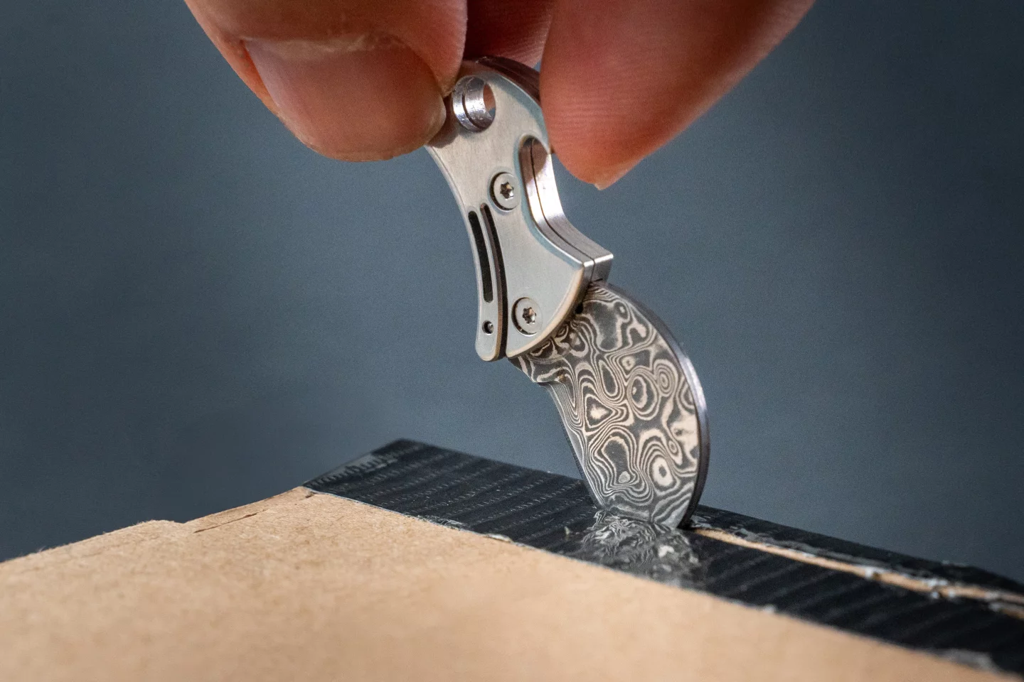 The Damascus steel blade goes to work