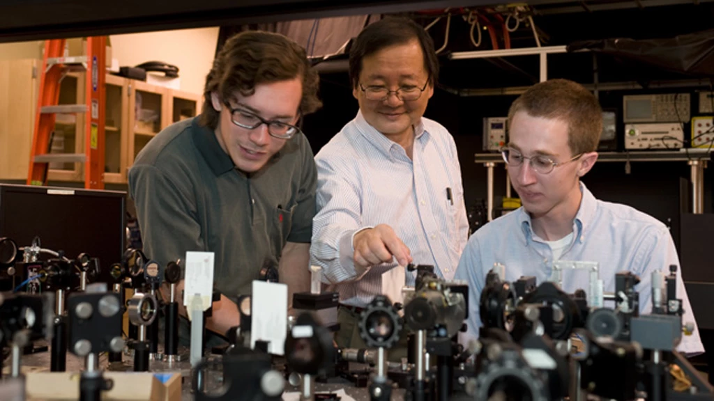 WSU chemist Choong-Shik Yoo, seen here with students, has used super-high pressures to create a compact, never-before-seen material capable of storing vast amounts of energy (Credit: WSU)