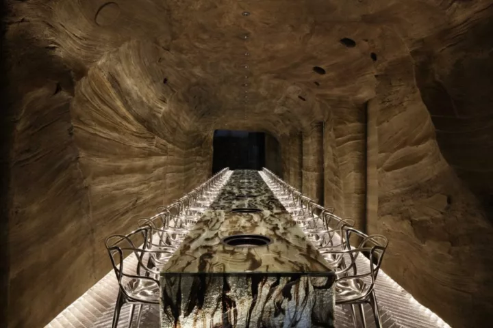 A nominee for Best Craftsmanship and Best Use of Material, this Japanese restaurant called Nikunotoriko consists of two floors: one resembles a cave with a bespoke long glass table, and the other floor is designed to be a hillside environment with laser-cut contoured floors