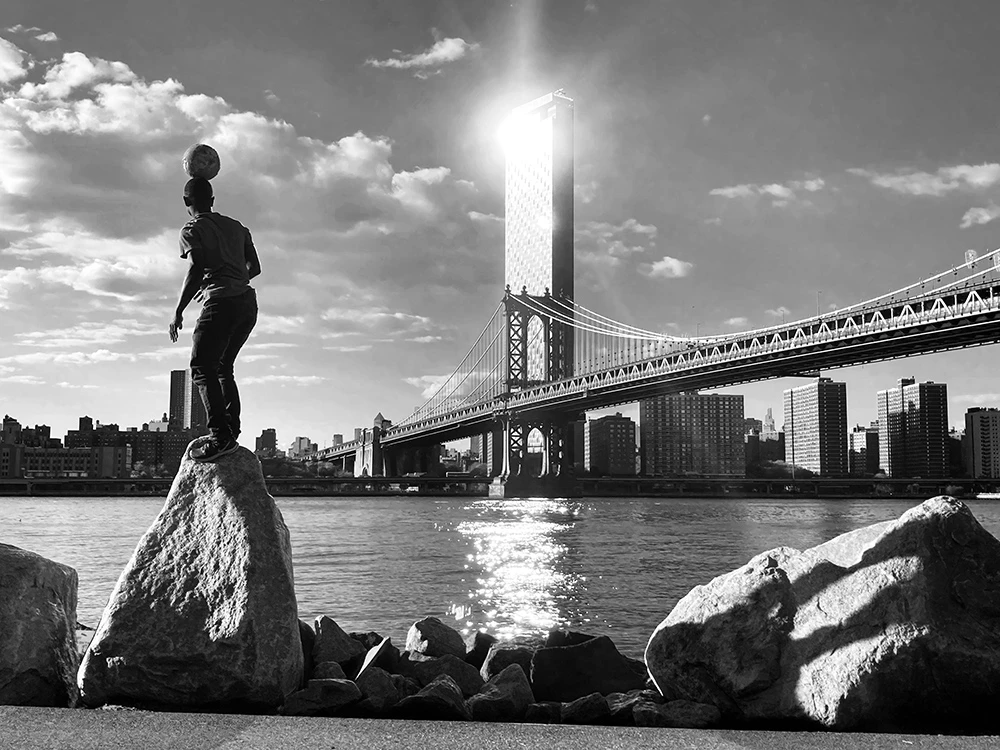 Honorable Mention, Street Photography. Balancing Act (NYC)