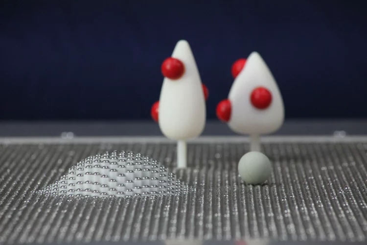 The MoleBot can interact with objects placed on the surface of the table