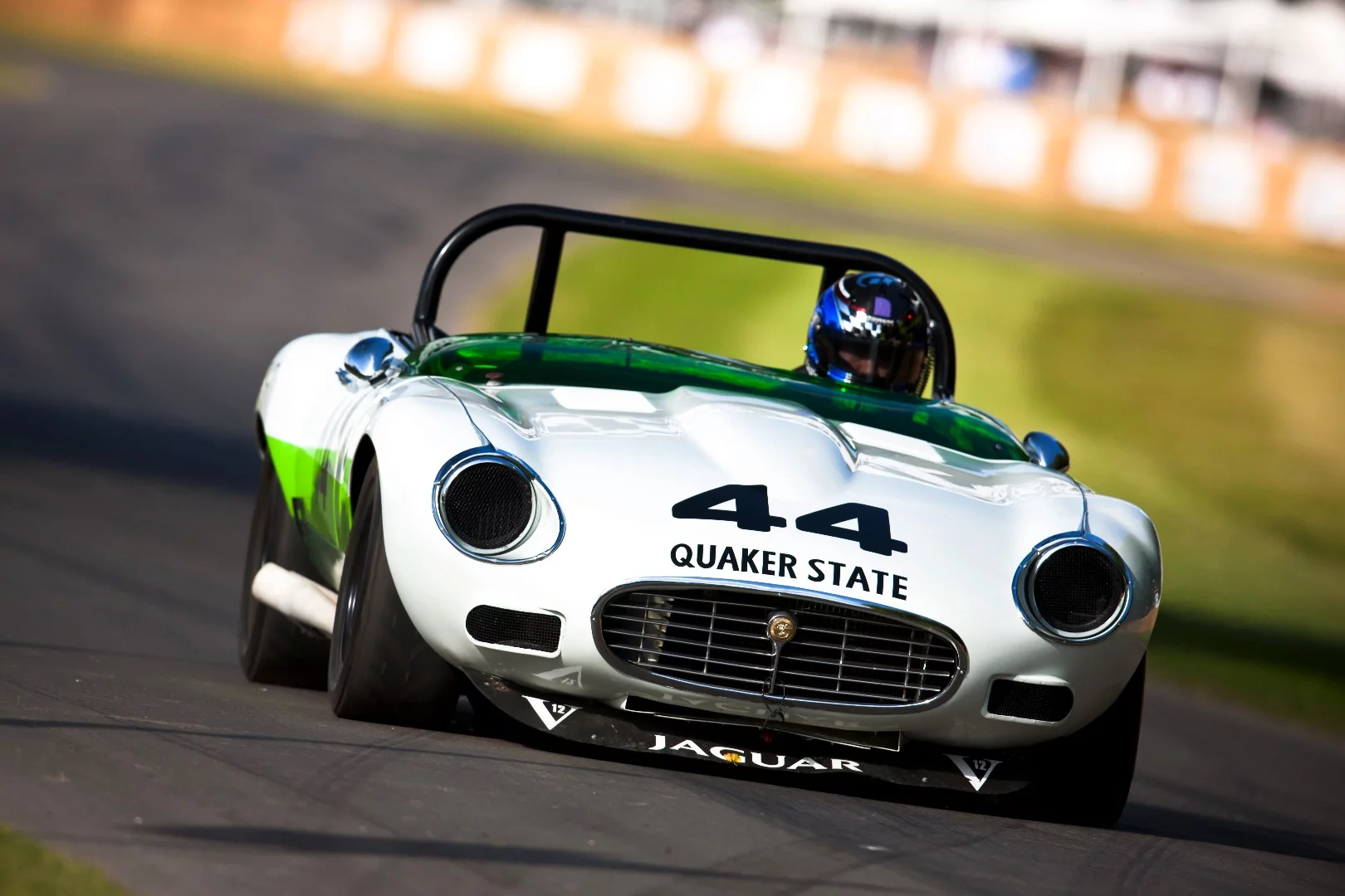 Kazunori Yamauchi in the Group 44 1974 Jaguar E-Type which won the Class B production car championship of the Sports Car Club of America (SCCA) in 1974 and 1975. Kazunori Yamauchi is the CEO of Polyphony Digital and creator of the ultra-realistic race simulator Gran Turismo video game series