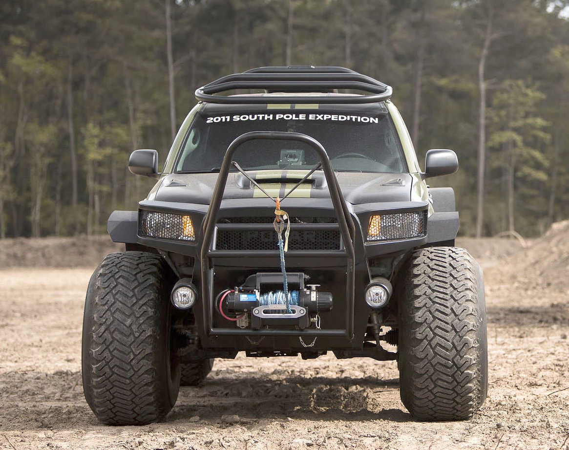 The 2010 Toyota Tacoma Polar Expedition as it will be auctioned is decked out in a NATO Green vinyl wrap over a Graphite interior with 14,281 miles on the odometer