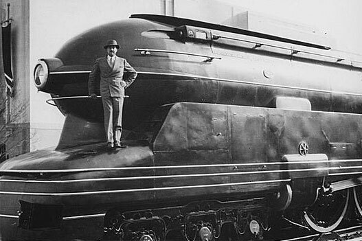 The Pennsylvania Railroad's S1 steam locomotive with Raymond Loewy on the cow catcher (Photo: Library of Congress)