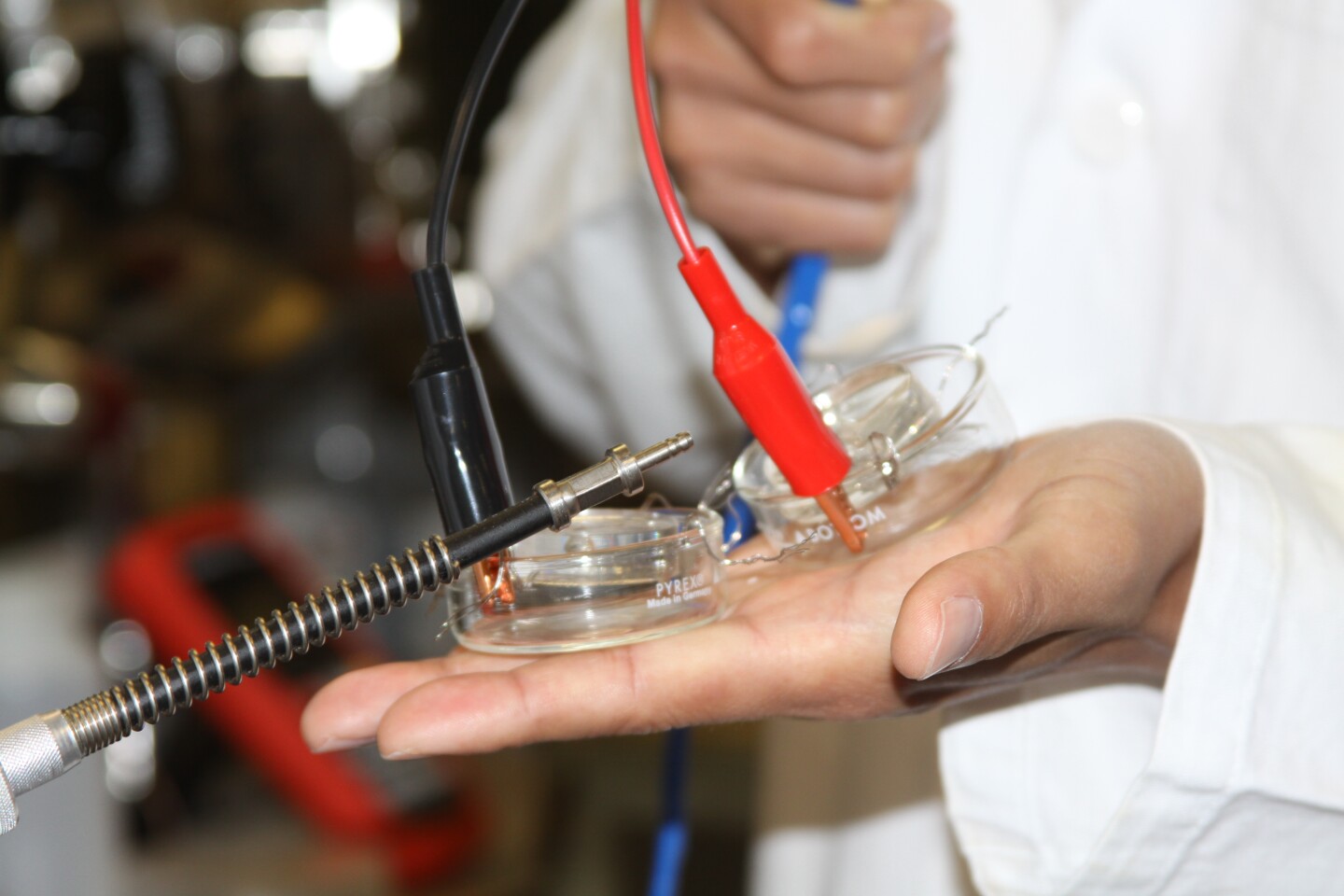 An electrical current is sent through the lead wires to heat an aqueous solution. The heat builds pressure, causing a tiny hole in an elastomer to open, releasing the odor, which is measured by the detector (Photo: Jacobs)
