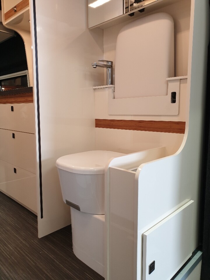 The rear sink flips up for toilet access