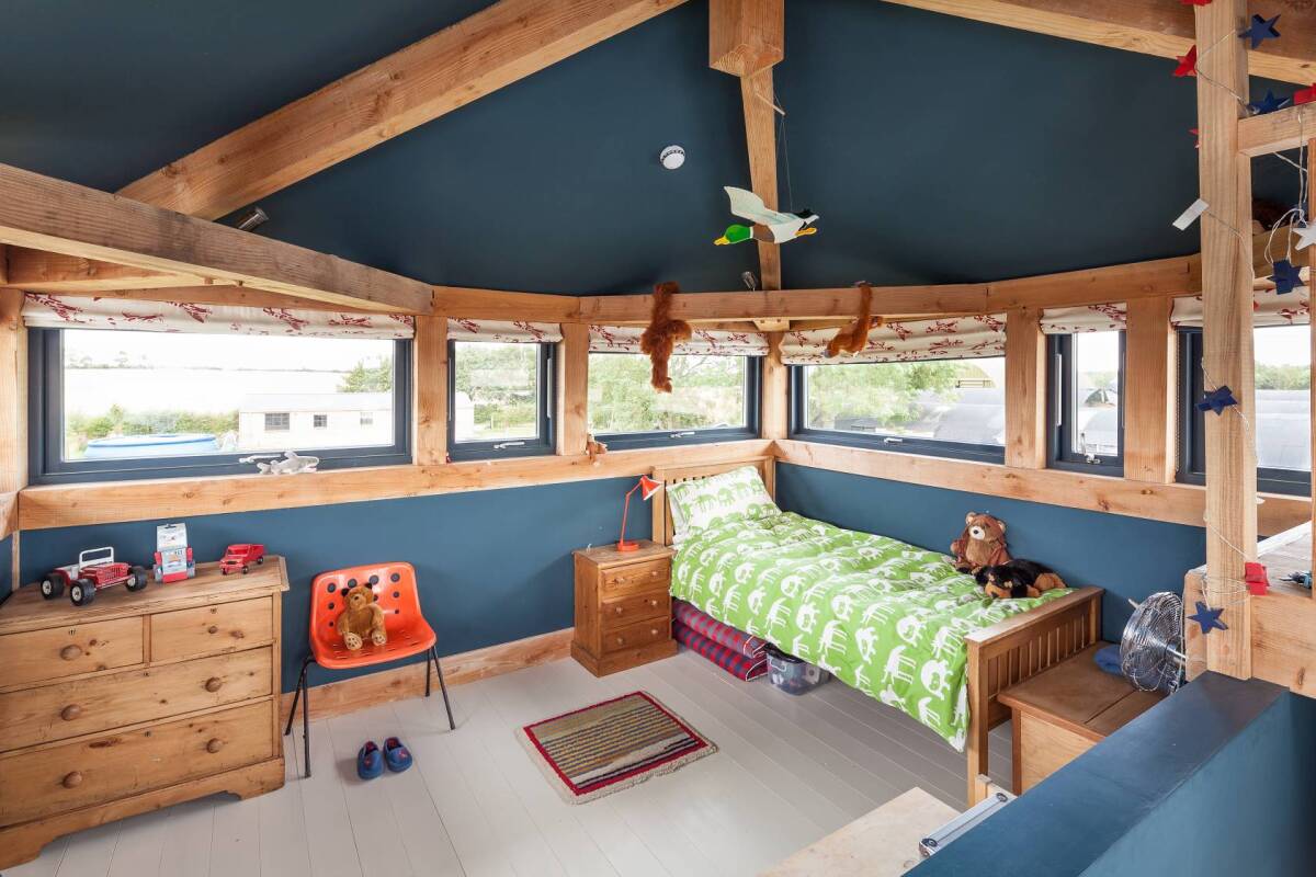 Though the Grays were striving for a farmhouse feel to the place, the building retains something of the airbase – particularly with the former tower, which is now the children's bedroom