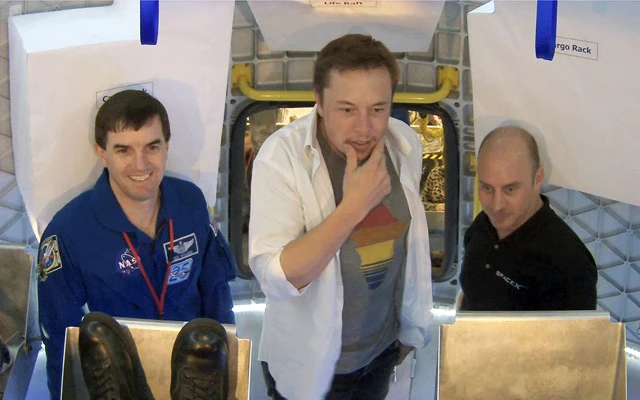 NASA Astronaut Rex Walheim, SpaceX CEO and Chief Designer Elon Musk and SpaceX Commercial Crew Development Managerand former NASA Astronaut Garrett Reisman standing inside the Dragon spacecraft during testing activities