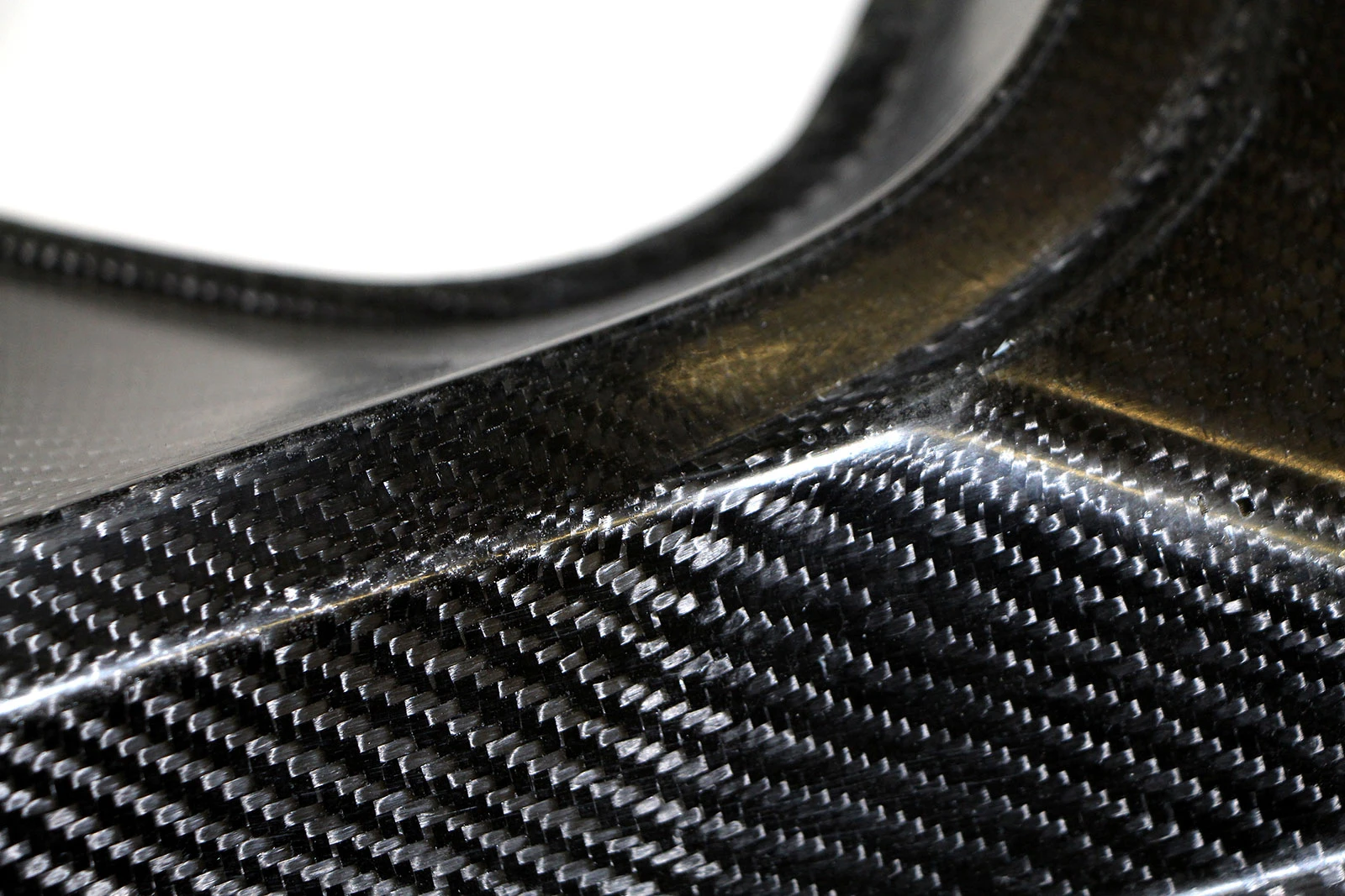 A carbon and hemp-fiber reinforced component such as this is a cheaper, greener hybrid composite that can do the job of pure carbon composites(Image: Fraunhofer)