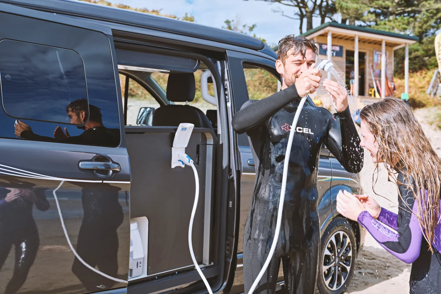 Rather than stow the toilet below a seating bench, like many other camper vans, Swift packages it into an outdoor bathroom space, making it easy to slide out and use outside