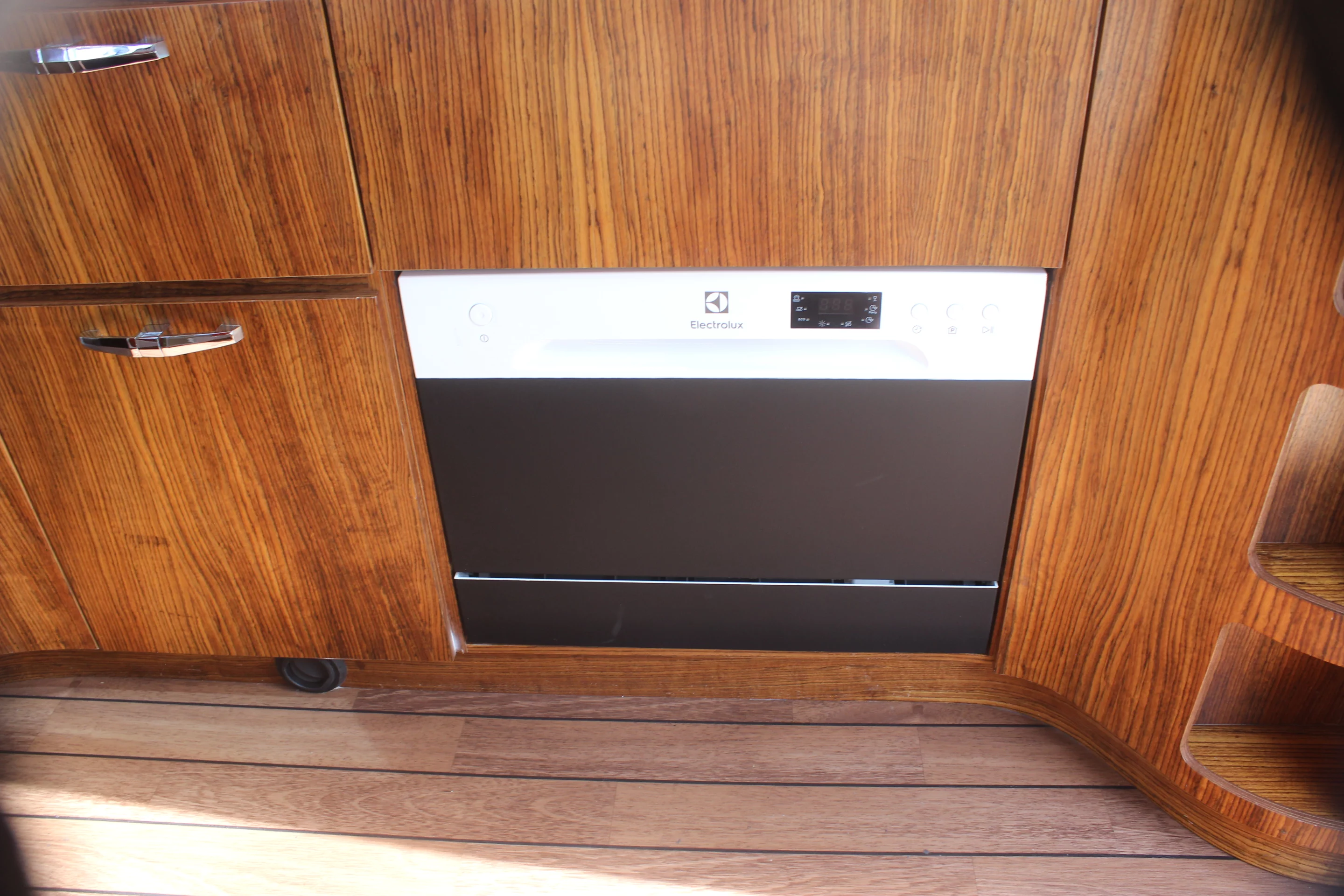 Caracat joked that the dishwasher is small, but it's a nice time-saving option