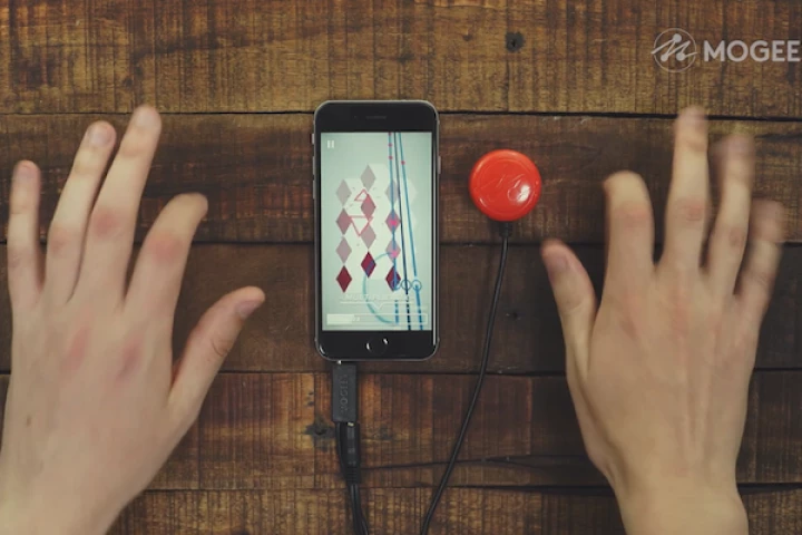 Mogees Play is a device that contains a contact microphone which records the vibrations as you tap surfaces, and transfers the signal into an app that lets you play games and make music