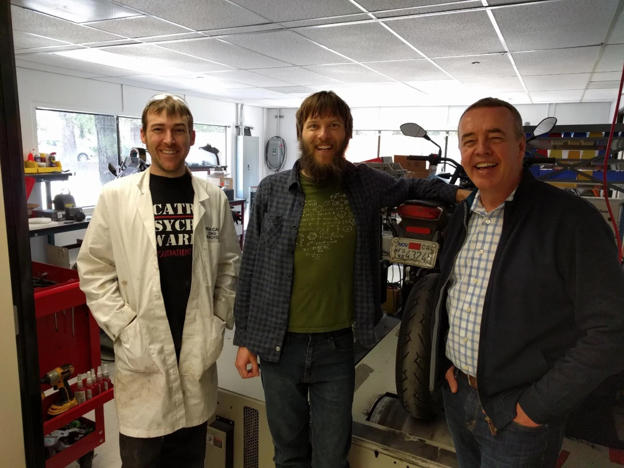 Luke Workman (centre) with Zero Motorcycles CEO Richard Walker (right) and Bryan Cady (left) - "Bryan Cady is Zero's R&D wizard of everything from polymer engineering to radar system design. His official title is something like R&D test engineer, but if it doesn't mention wizard or epic super-genius it seems less accurate."