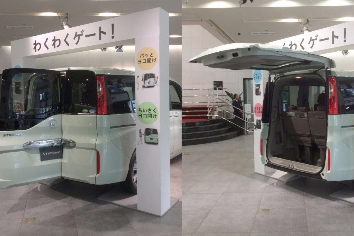 The design combines a wide top-hinged tailgate with a sub-door that opens sideways for passenger access