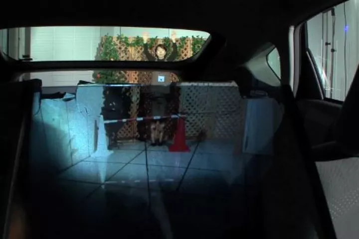 A new in-car rear video system makes the back seat appear transparent, allowing drivers to see more of the road behind them