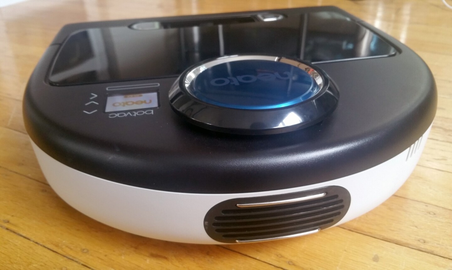 The Botvac D80 automatically parks its charging connectors against the base station as needed