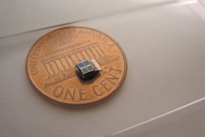 A low-power sensor system developed at the University of Michigan is 1,000 times smaller than comparable commercial counterparts. It could enable new biomedical implants. Photo (Daeyeon Kim)