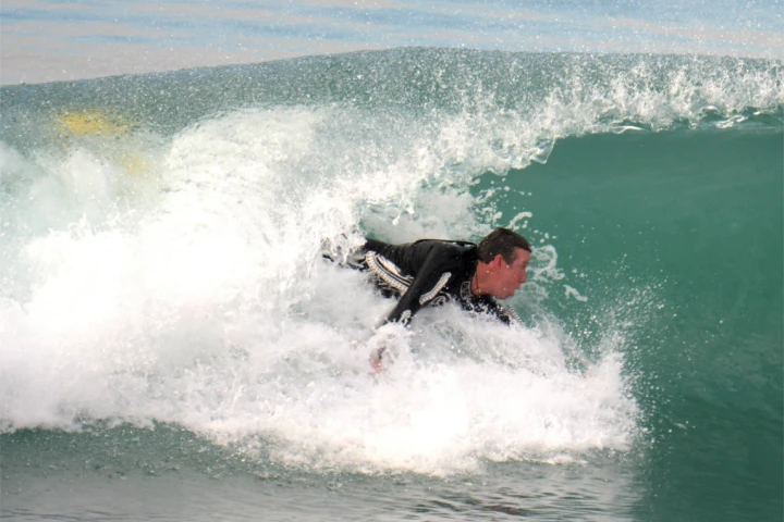 A WaveWrecker user in the surf