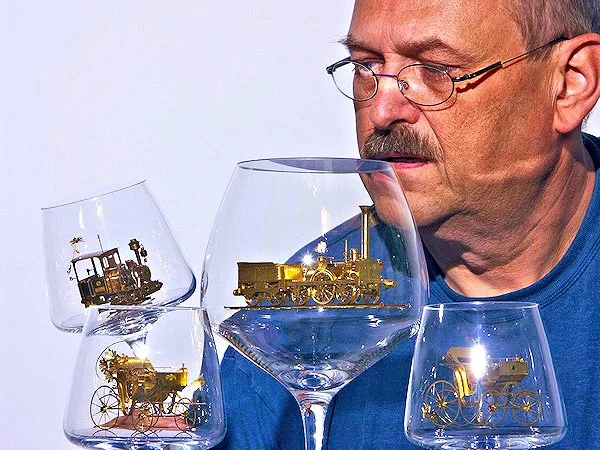 Szymon Klimek with a handful of his miniatures (Photo: Szymon Klimek)