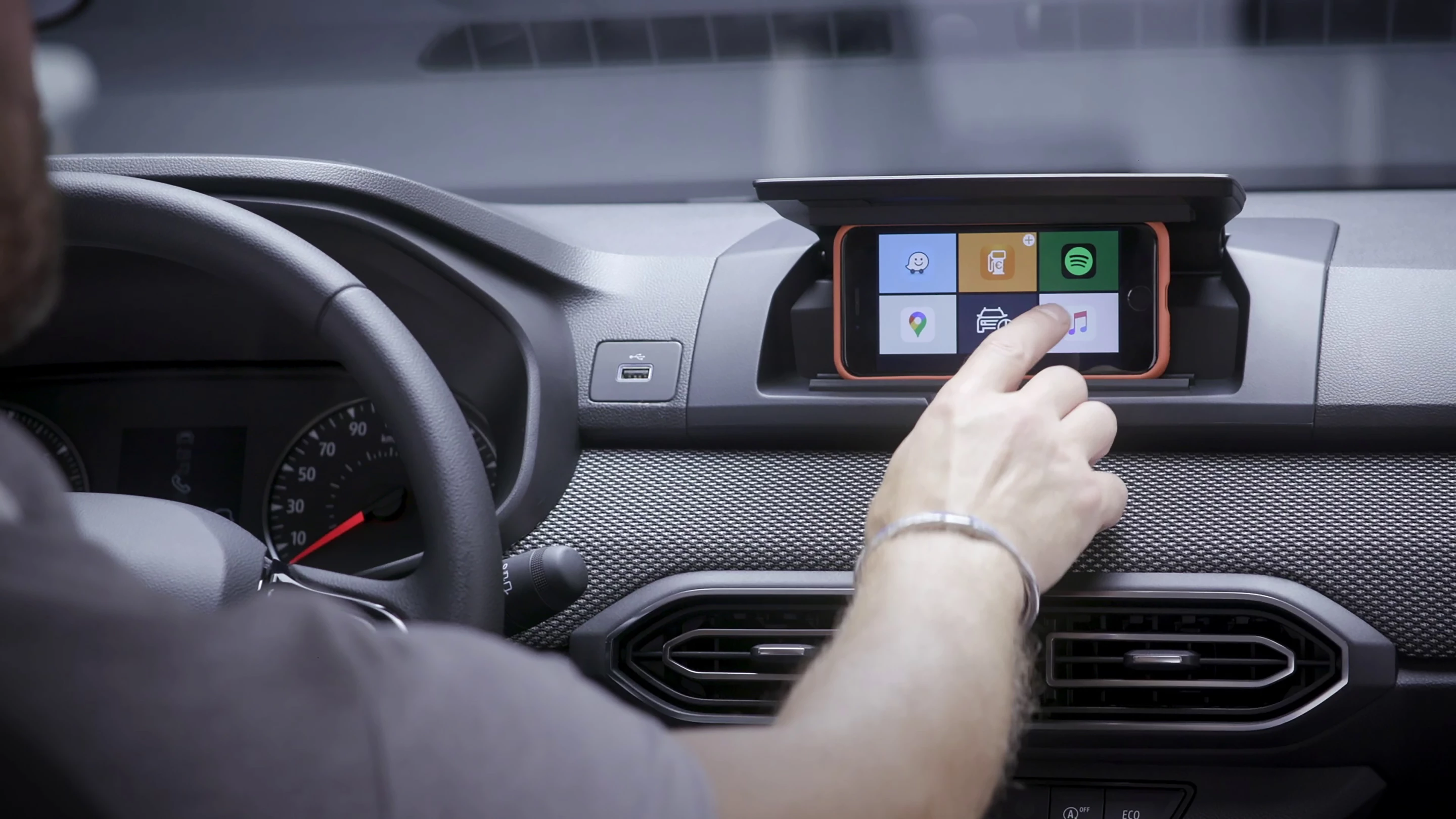 The Media Control system replaces a built-in infotainment screen with the driver's own smartphone