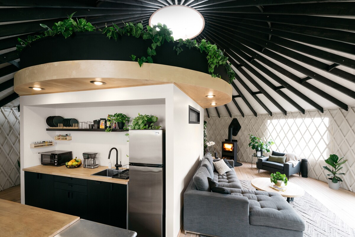 The interior has been personally adapted by the couple to include a central core unit that houses the home's modern kitchen