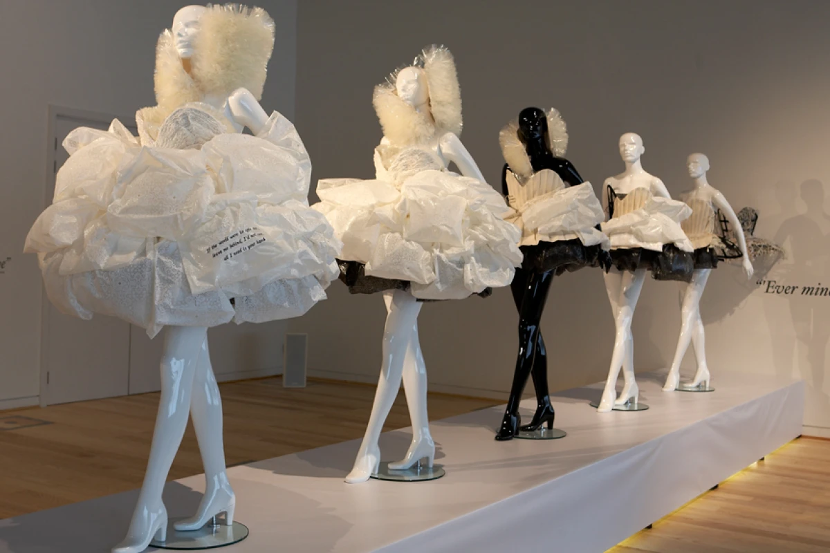 The five pieces show the transformation in stages from wedding dress to fashion garment and ultimately to dissolution